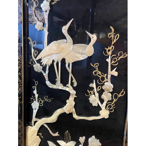 175 - PAIR OF BLACK LACQUERED AND MOTHER OF PEARL SHIBAYAMA STYLE ORIENTAL PANELS OF HERONS AMIDST FOLIAGE