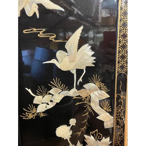 175 - PAIR OF BLACK LACQUERED AND MOTHER OF PEARL SHIBAYAMA STYLE ORIENTAL PANELS OF HERONS AMIDST FOLIAGE