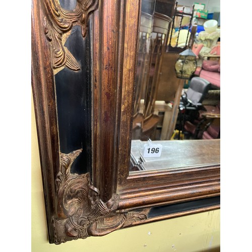 196 - EBONISED AND BURNISHED GILT WOOD BEVELLED MIRROR