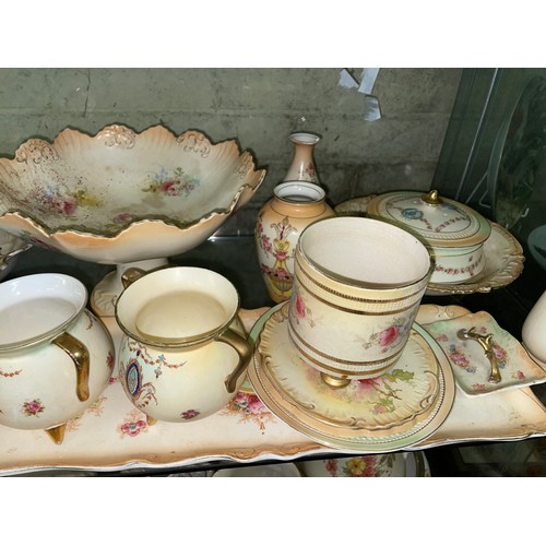 291 - TWO SHELVES OF CROWN DEVON BLUSH IVORY FLORAL CERAMICS INCLUDING PAIR OF CANDLESTICKS, SARDINE DISH ... 