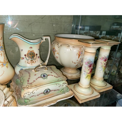 291 - TWO SHELVES OF CROWN DEVON BLUSH IVORY FLORAL CERAMICS INCLUDING PAIR OF CANDLESTICKS, SARDINE DISH ... 