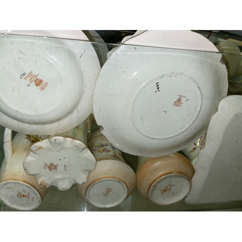 291 - TWO SHELVES OF CROWN DEVON BLUSH IVORY FLORAL CERAMICS INCLUDING PAIR OF CANDLESTICKS, SARDINE DISH ... 