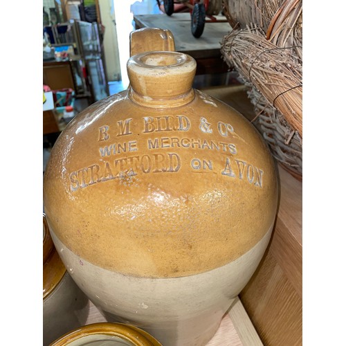 345 - STONEWARE ADVERTISING FLAGON FOR STRATFORD UPON AVON AND THREE STORAGE JARS