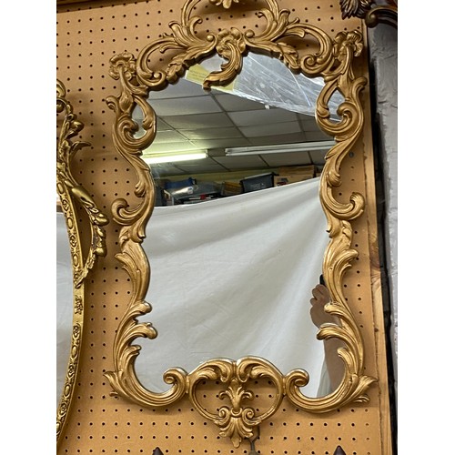 456 - GILT ATHEMIUM SCROLL OVAL MIRROR AND AN ACANTHUS SCROLL FRAMED MIRROR