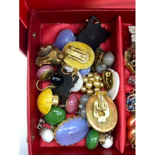 565 - SMALL RED CANTILEVER BOX OF DRESS JEWELLERY INCLUDING EARRINGS, VARIOUS CHAINS, WRISTWATCHES AND GEN... 