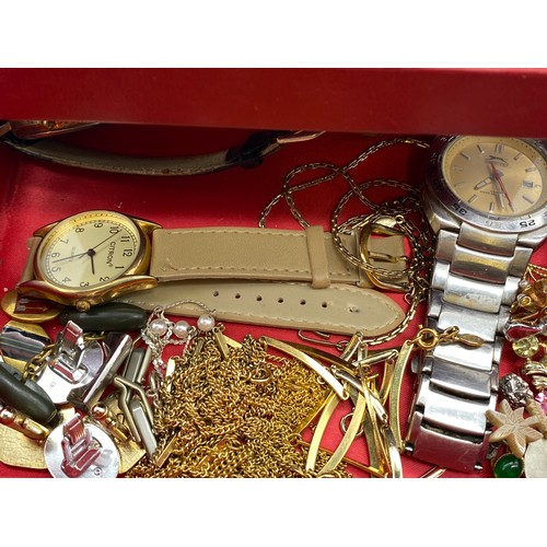 565 - SMALL RED CANTILEVER BOX OF DRESS JEWELLERY INCLUDING EARRINGS, VARIOUS CHAINS, WRISTWATCHES AND GEN... 