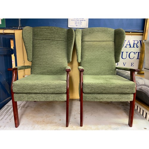 136 - THREE GREEN UPHOLSTERED WING BACKED ARMCHAIRS