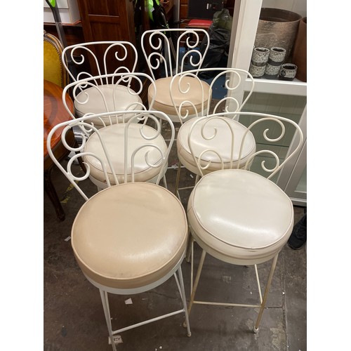 119 - SIX WHITE PAINTED WROUGHT IRON SCROLL BACK BAR STOOLS WITH CREAM LEATHER SEATS