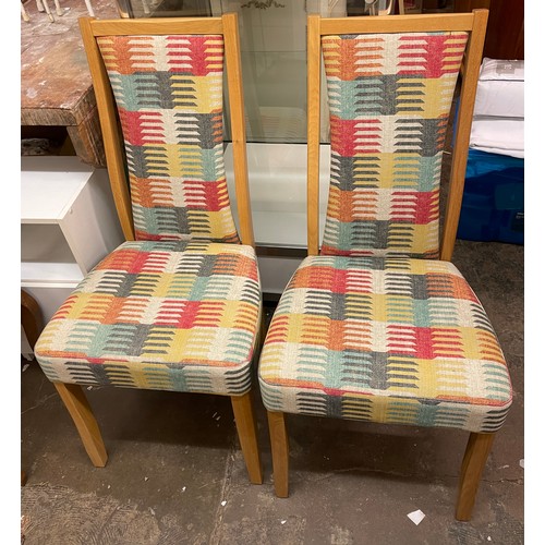 114 - FOUR LIGHT ERCOL HIGHBACK DINING CHAIRS WITH GEOMETRIC UPHOLSTERED FABRIC PANELS