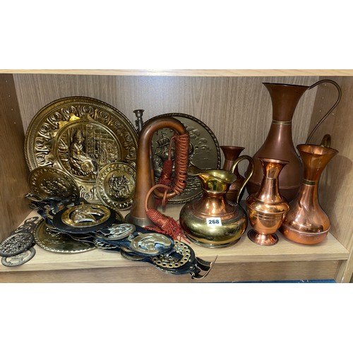 268 - SHELF OF BRASS MARTINGALES ON STRAPS, COPPER AND BRASS BANDED JUGS AND A VINTAGE BUGLE HORN