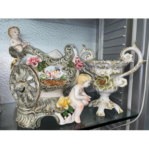 288 - ITALIAN POTTERY CHERUB CART AND A CAPODIMONTE TWIN HANDLED ROSE VASE