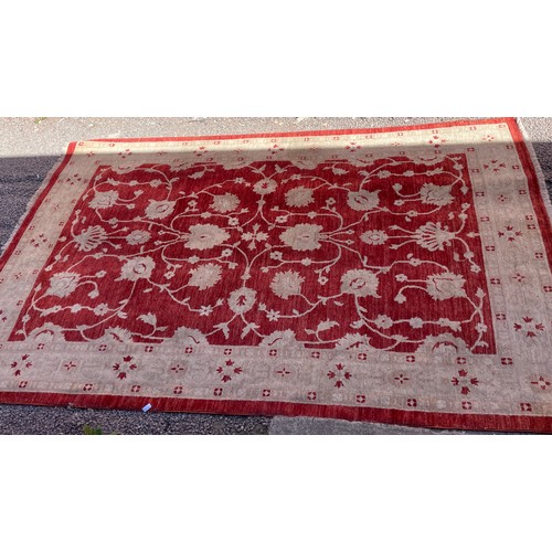 74 - RED AND CREAM FLORAL PATTERNED CARPET