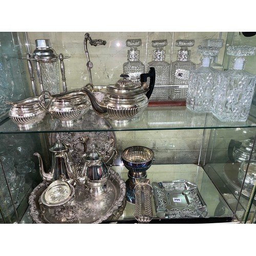 294 - SHELF OF EPNS WARE INC. TANTALUS AND DECANTERS, COCKTAIL SHAKER, REGENCY STYLE TEA SET, ETC.