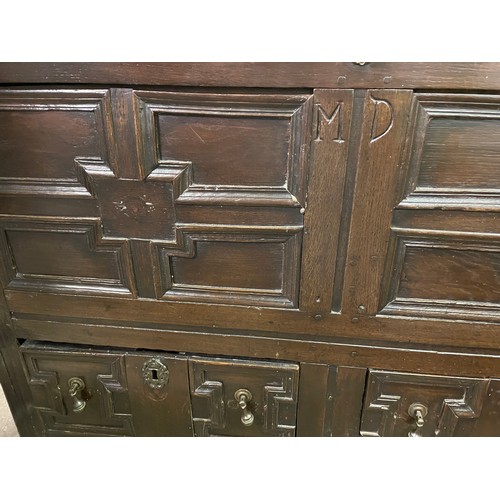 106 - 17TH CENTURY OAK MULE CHEST WITH GEOMETRIC MOULDED PANELLED FRONTS AND DRAWERS INITIALLED MD 115CM W... 