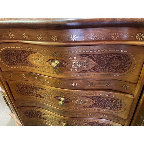 105 - BURMESE ROSE WOOD CARVED AND BRASS TENDRIL INLAID SERPENTINE CHEST OF DRAWERS