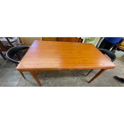 137 - 1960S DANISH TEAK EXTENDING DINING TABLE AND FOUR ARMCHAIRS DESIGNED BY JOHANNES ANDERSEN FOR BRDR. ... 