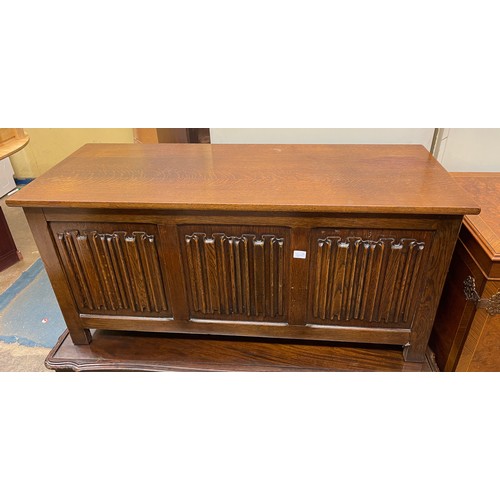 54 - REPRODUCTION OAK THREE LINEN FOLD PANELLED COFFER