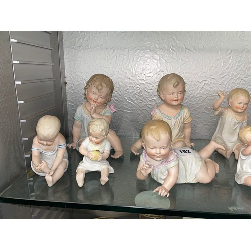 192 - SHELF OF PREDOMINANTLY CONTINENTAL BISQUE PORCELAIN PIANO BABY DOLLS