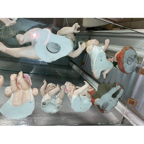 192 - SHELF OF PREDOMINANTLY CONTINENTAL BISQUE PORCELAIN PIANO BABY DOLLS