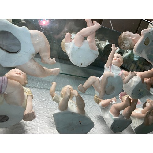 192 - SHELF OF PREDOMINANTLY CONTINENTAL BISQUE PORCELAIN PIANO BABY DOLLS