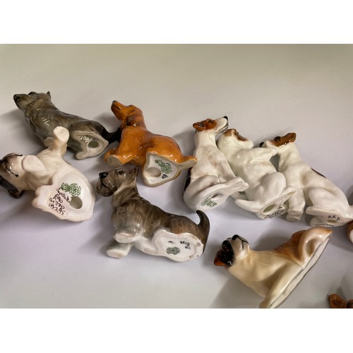 282 - TWELVE ROYAL DOULTON DOG FIGURES INCLUDING CORGI, JACK RUSSELL, SPANIEL, AND BULL DOG, ETC