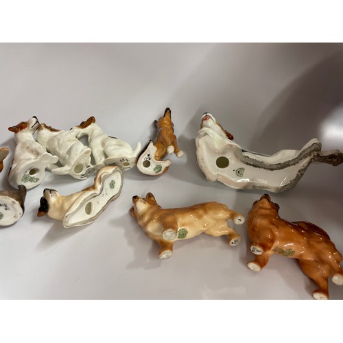 282 - TWELVE ROYAL DOULTON DOG FIGURES INCLUDING CORGI, JACK RUSSELL, SPANIEL, AND BULL DOG, ETC