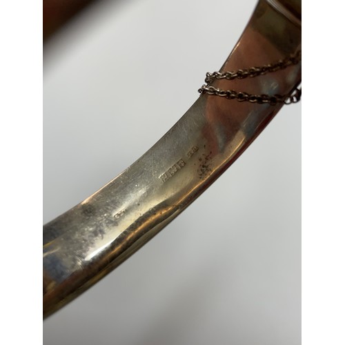 436 - SILVER AND ROSE COLOURED METAL ENGRAVED BANGLE WITH SAFETY CHAIN