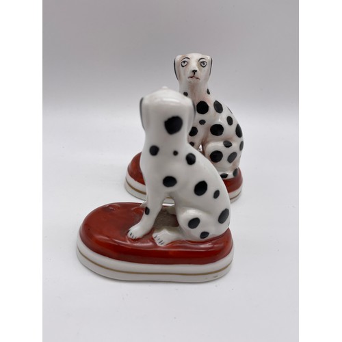 325 - TWO REPRODUCTION SEATED DALMATIAN FIGURES IN THE STYLE OF CHELSEA 7.5cm x 7cm