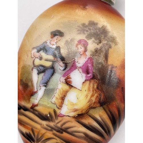 385 - BIRMINGHAM SILVER SCREW TOPPED PORCELAIN OVAL SCENT BOTTLE PANTED WITH 18TH CENTURY COUPLE 6cm x 3.5... 