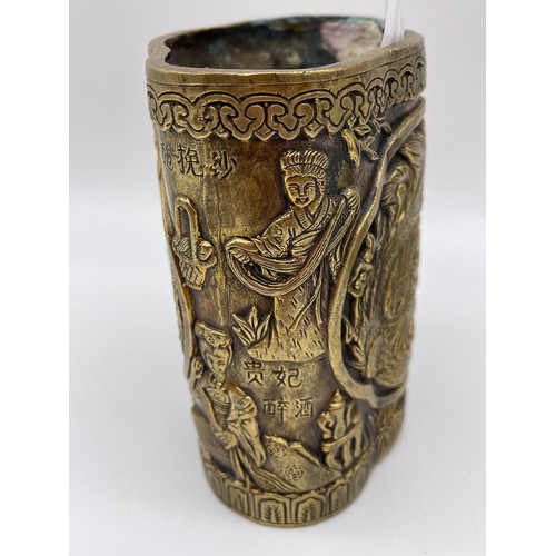 340 - CHINESE BRONZE LOBED POT DECORATED WITH FIGURES AND DRAGONS SCRIPT MARK TO UNDERSIDE 9cm x 8cm