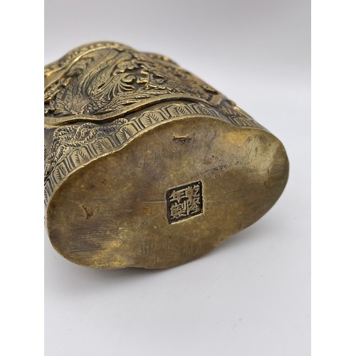 340 - CHINESE BRONZE LOBED POT DECORATED WITH FIGURES AND DRAGONS SCRIPT MARK TO UNDERSIDE 9cm x 8cm