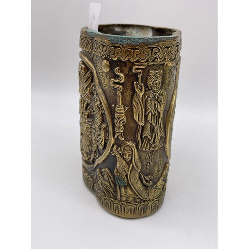 340 - CHINESE BRONZE LOBED POT DECORATED WITH FIGURES AND DRAGONS SCRIPT MARK TO UNDERSIDE 9cm x 8cm