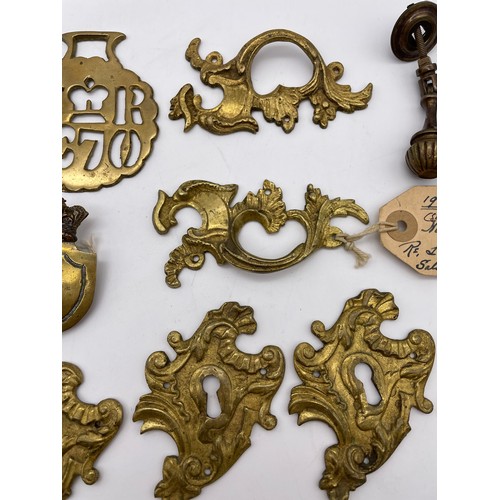 317 - FRENCH ROCOCCO GILT METAL ESCUTCHEON PLATES, OTHER HANDLES, AND A CARYATYD MOUNT