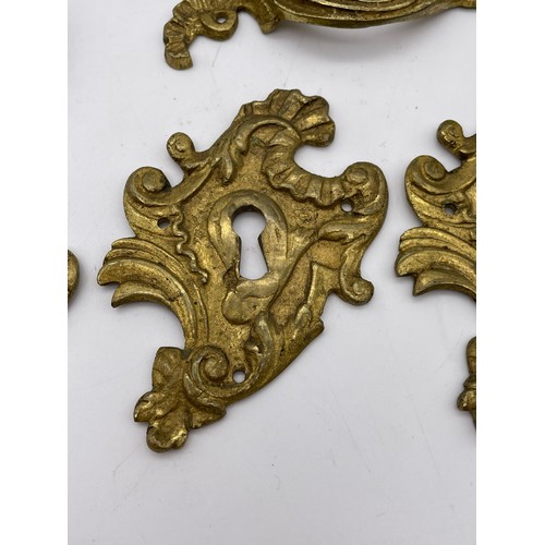 317 - FRENCH ROCOCCO GILT METAL ESCUTCHEON PLATES, OTHER HANDLES, AND A CARYATYD MOUNT