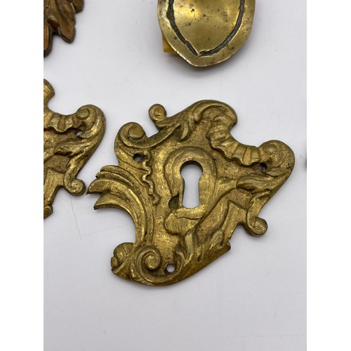 317 - FRENCH ROCOCCO GILT METAL ESCUTCHEON PLATES, OTHER HANDLES, AND A CARYATYD MOUNT