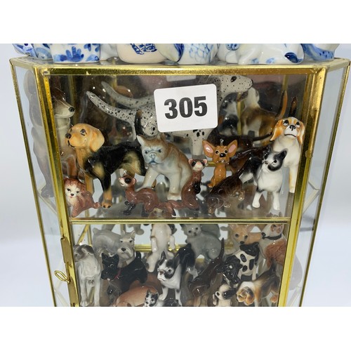 305 - THREE TIER GLAZED CABINET OF CERAMIC MAINLY DOG AND ANIMAL FIGURES