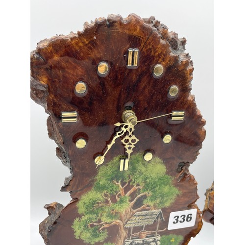 336 - TWO WESTERN AUSTRALIA MALLEE WOOD HAND PAINTED BATTERY OPERATED CLOCKS SIGNED BT 30cm x 20cm