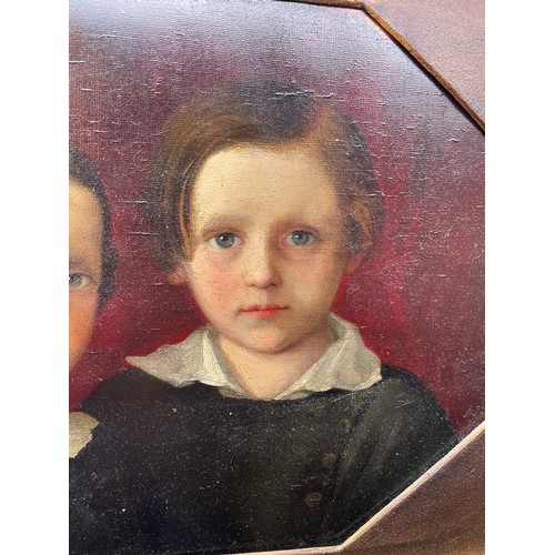 507 - 19TH CENTURY OIL ON OCTAGONAL CANVAS PORTRAIT STUDY OF A BROTHER AND SISTER, UNSIGNED IN ORNATE FRAM... 