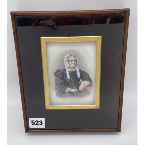 523 - 19TH CENTURY PORTRAIT MINIATURE ON PORCELAIN OF A SEATED VICTORIAN LADY IN BLACK SILK GOWN IN A GLAZ... 