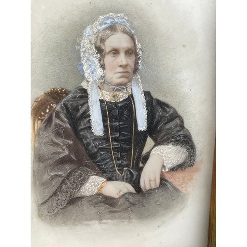 523 - 19TH CENTURY PORTRAIT MINIATURE ON PORCELAIN OF A SEATED VICTORIAN LADY IN BLACK SILK GOWN IN A GLAZ... 