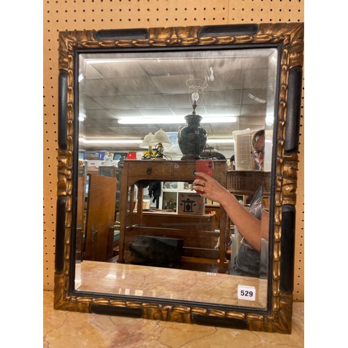 529 - 20TH CENTURY EBONISED AND GILT ACANTHUS CORNED MIRROR WITH BEVELLED PLATE 57cm x 48cm