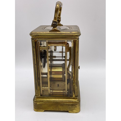 396 - BRASS CASED CARRIAGE CLOCK WITH BEVELLED GLASS PANELS WITH KEY