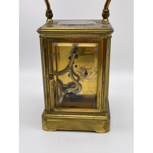 396 - BRASS CASED CARRIAGE CLOCK WITH BEVELLED GLASS PANELS WITH KEY