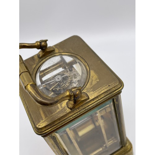 396 - BRASS CASED CARRIAGE CLOCK WITH BEVELLED GLASS PANELS WITH KEY