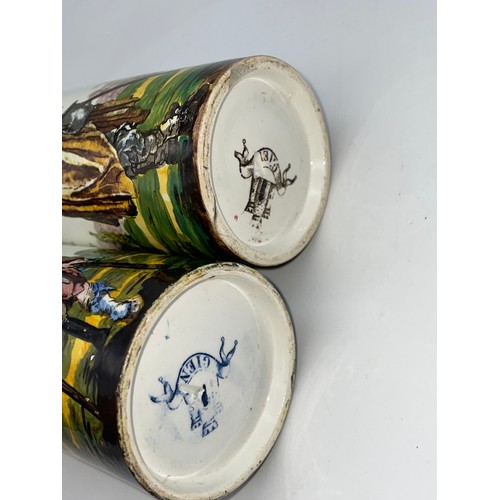 369 - PAIR OF 19TH CENTURY FRENCH GIEN CYLINDRICAL VASES DECORATED WITH FIGURES 12cm