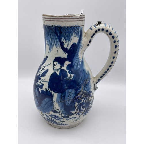 370 - 18TH CENTURY TIN GLAZED EARTHENWARE BLUE AND WHITE PITCHER JUG A/F 21cm