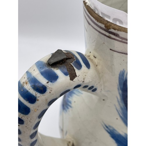 370 - 18TH CENTURY TIN GLAZED EARTHENWARE BLUE AND WHITE PITCHER JUG A/F 21cm