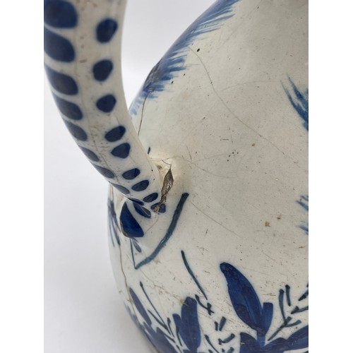 370 - 18TH CENTURY TIN GLAZED EARTHENWARE BLUE AND WHITE PITCHER JUG A/F 21cm