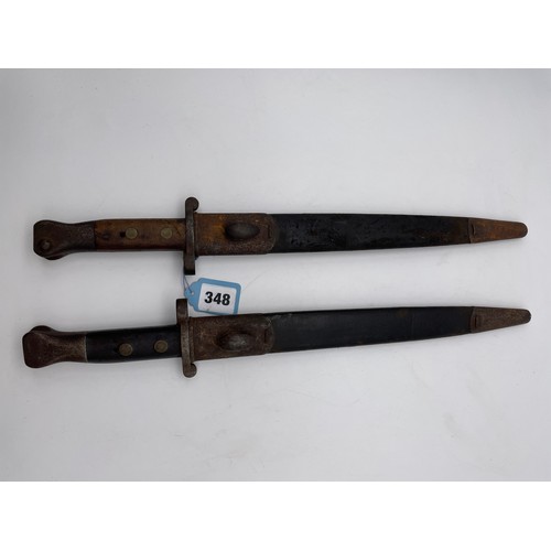 348 - TWO PLUG BAYONETS IN SCABBARDS