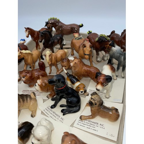 310 - SHELF OF HAGEN-RENAKER DOG AND HORSE FIGURE GROUPS